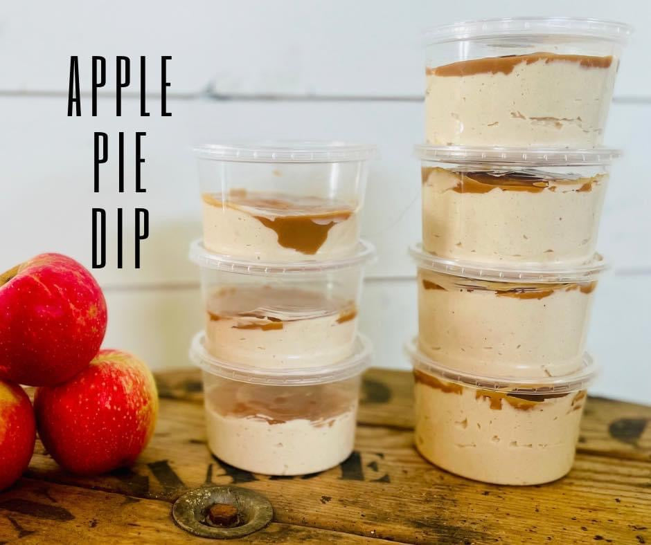 Stacked deli plastic containers filled with apple pie dip, with apples to the side and a sign reading 'APPLE PIE DIP'.
Made in the kitchen of Nystrom Orchard in Worthington Minnesota.
