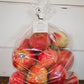 5 lb plastic bag of fireside apples on a wooden table with a white background. Picked in Nystrom Orchard in Worthington Minnesota.