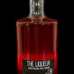 Bottle of apple liqueur on a black background. Made in the kitchen in Nystrom Orchard in Worthington Minnesota. 