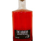 Hand pressed apple liqueur in a glass bottle on a white background. Made in the kitchen of Nystrom Orchard in Worthington Minnesota.