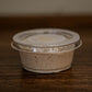 Mini apple pie dip in a 2 oz container on a wooden surface. Made in the kitchen of Nystrom Orchard in Worthington Minnesota.