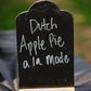 A black sign that says dutch apple pie a la mode with a blurry background in Nystrom Orchard in Worthington Minnesota.