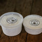 Two different sized containers of everything bagel dip on a wooden surface.  Made in the kitchen of Nystrom Orchard in Worthington Minnesota.