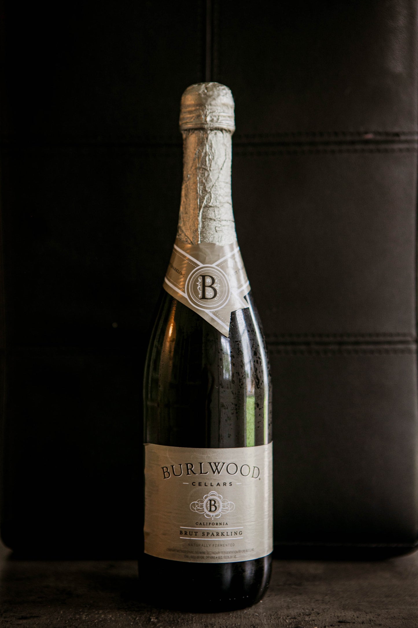 Bottle of champagne with a black background. Sold in the store of Nystrom Orchard in Worthington Minnesota.