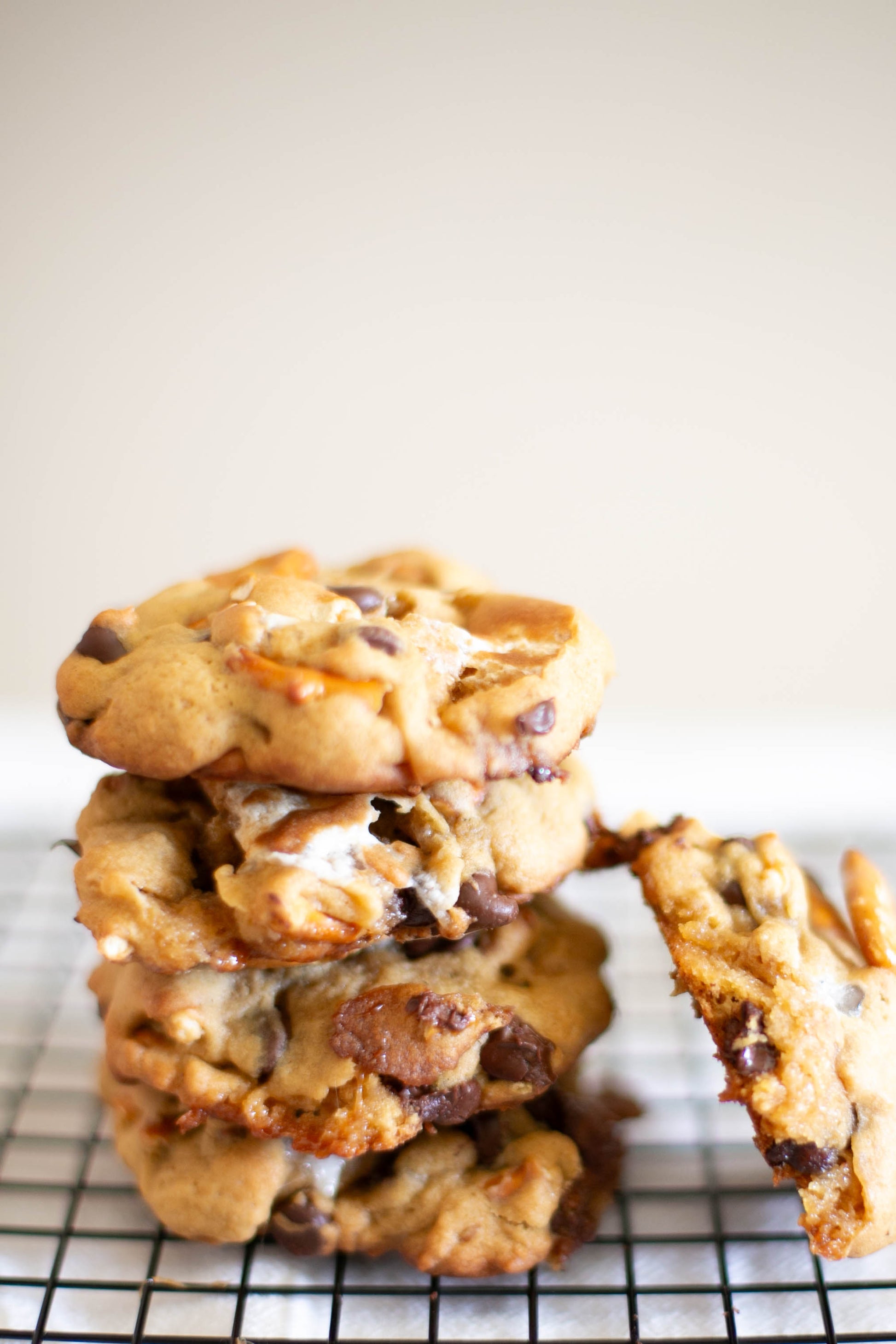 Stack of chocolate, marshmallow, pretzel cookies on a cooling rack with a white background. Baked in the kitchen of Nystrom Orchard in Worthington Minnesota.
