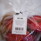 Cortland tag on a bag of Cortland apples with a blurry background. Picked in Nystrom Orchard in Worthington Minnesota.