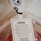 Fireside apple tag on a bag of appes with a white background. Picked in Nystrom Orchard in Worthington Minnesota.