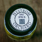 Jar of garlic dipping oil with 'Nystrom Orchard' label on a wooden surface