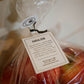 Apples in a plastic bag with a prominent tag that has branding as well. Picked in Nystrom Orchard in Worthington Minnesota. 