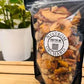 Snack mix composed of chex cereal, pretzels, goldfish, almonds, and dried apples with a sweet and spicy coating. Made in the kitchen of Nystrom Orchard in Worthington Minnesota.