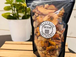 Snack mix composed of chex cereal, pretzels, goldfish, almonds, and dried apples with a sweet and spicy coating. Made in the kitchen of Nystrom Orchard in Worthington Minnesota.