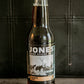 Glass bottle of Jones root beer soda on a dark background. Sold in the store of Nystrom Orchard in Worthington Minnesota.