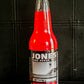 Glass bottle of Jones strawberry lime flavored soda on a dark background. Sold in the store of Nystrom Orchard in Worthington Minnesota.