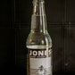 Glass bottle of Jones Cream flavored soda on a dark background. Sold in the store of Nystrom Orchard in Worthington Minnesota.