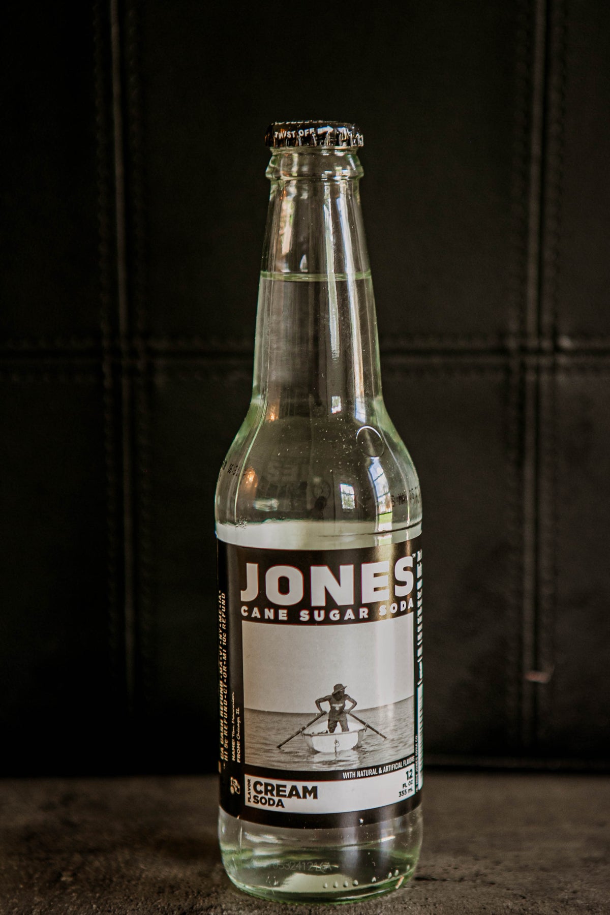Glass bottle of Jones Cream flavored soda on a dark background. Sold in the store of Nystrom Orchard in Worthington Minnesota.
