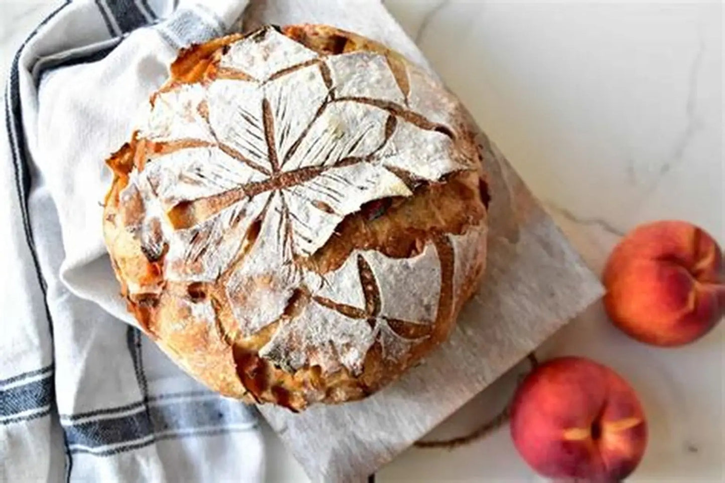 Peaches and cream cheese sourdough bread swirled with fresh peaches, and cream cheese.  Made by Nystrom Orchard in Worthington Minnesota.
