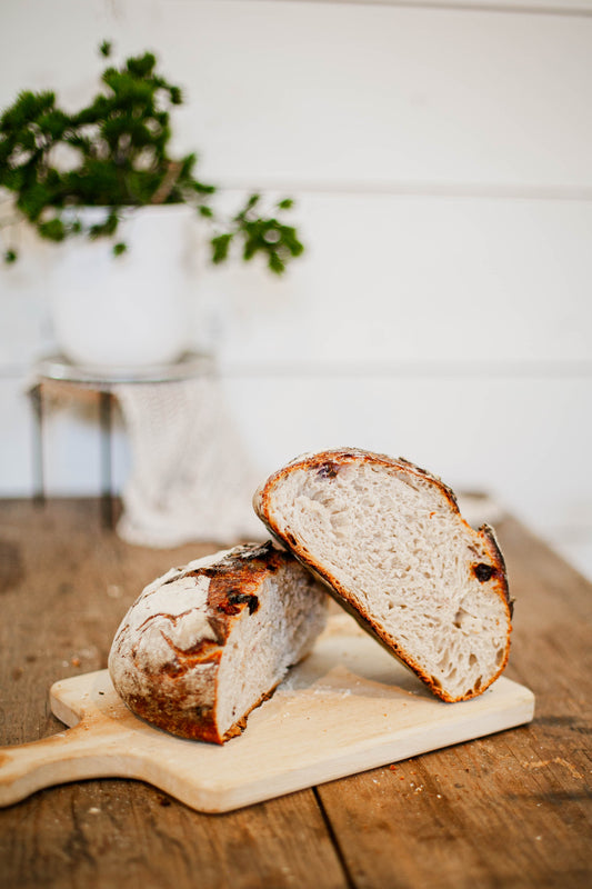 A loaf of roasted garlic and herb sourdough bread that goes well soup, or sandwiches. It's also is a nice side for eggs. Made by Nystrom Orchard in Worthington Minnesota.