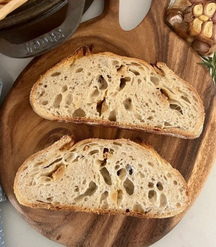 Slices of Sourdough bread with garlic and onions caramelized into a mellow flavor. This bread is perfect for garlic bread or a side for soup. Made by Nystrom Orchard in Worthington Minnesota.