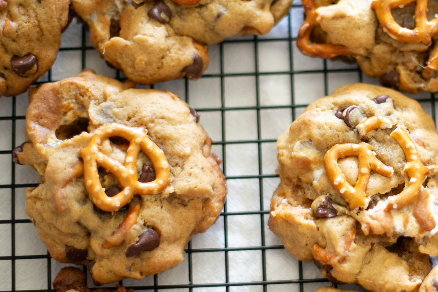 Cookies with pretzels, marshmallows and chocolate chips on a cooling rack. Baked in the kitchen at Nystrom Orchard in Worthington Minnesota.