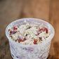 Side view of chicken salad in a 16 oz deli container on a wooden surface. Made in the kitchen at Nystrom Orchard in Worthington Minnesota.