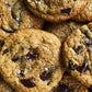 Close-up of sourdough chocolate chip cookies with chocolate chunks and sea salt. Made in the kitchen of Nystrom Orchard in Worthington Minnesota.