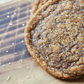 A close up of sourdough pumpkin spice sourdough cookies on a wooden surface.  Baked in the kitchen of Nystrom Orchard in Worthington Minnesota.