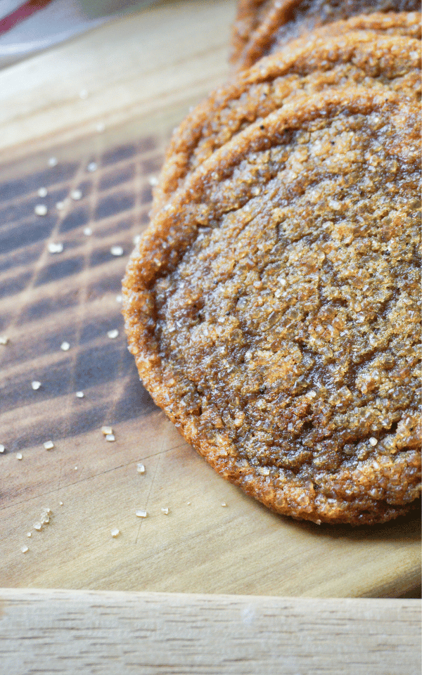 A close up of sourdough pumpkin spice sourdough cookies on a wooden surface.  Baked in the kitchen of Nystrom Orchard in Worthington Minnesota.