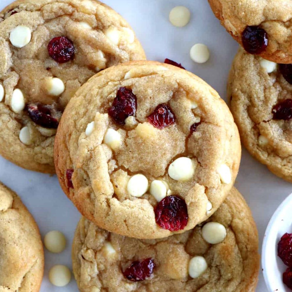Sourdough cranberry white chocolate chip cookies on a white background.  Baked in the kitchen of Nystrom Orchard in Worthington Minnesota.