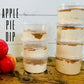 Stacked deli plastic containers filled with apple pie dip, with apples to the side and a sign reading 'APPLE PIE DIP'.
Made in the kitchen of Nystrom Orchard in Worthington Minnesota.