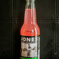 Glass bottle of Jones watermelon flavored soda on a dark background. Sold in the store of Nystrom Orchard in Worthington Minnesota.